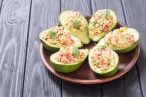 Fresh avocado halves – healthy fat fruit that reduces bad cholesterol and supports heart wellness.